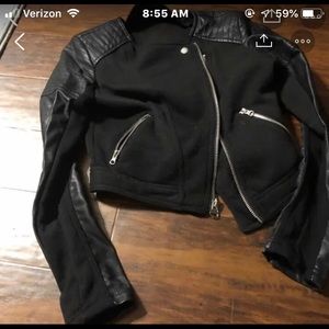 Leather jacket with fabric material in the middle